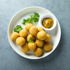 Homemade salmon croquettes with mustard