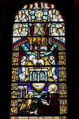 St Ann's Belfast protestant cathedral, Northern Ireland.  Stained glass. King Jesus blessing the world, the lamb of God and evangelist St John. Ulster, U.K.