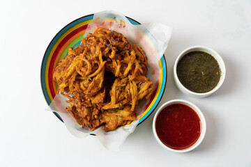 Fried onion pakora favourite Indian-pakistani Tea-Time snack during the rainy season. served with...