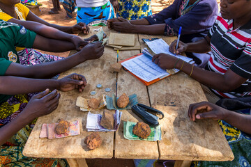 Microfinance loan reimbursement in Northern Togo. - obrazy, fototapety, plakaty