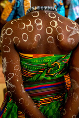 Girl in traditional costume attending a celebration for the 20th anniversary of Radio Maria in Cristo Risorto de Hedzranawoe catholic parish church, LomÃ©, Togo.