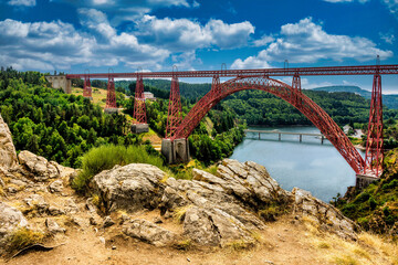 Fototapeta na wymiar Viaduc de Garabit, entièrement métallique, ce pont ferroviaire réalisé par Gustave Eiffel est situé sur la rivière Truyere . Cantal departement. Auvergne Rhone Alpes. France