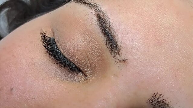 Close up of eye with eyelash extensions ,beauty salon treatment ,2d volume, 3d volume, classical lashes,Russian volume,megavolume, new set