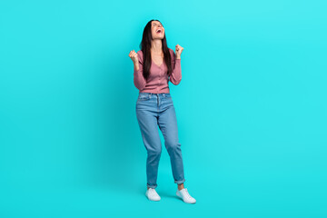 Full size portrait of disappointed unsatisfied girl raise fists scream yell isolated on teal color background - obrazy, fototapety, plakaty