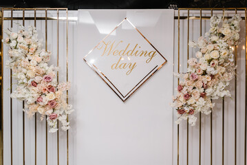 Arch with text wedding day. Wedding reception for luxury ceremony. Photo wall, arch decorated...