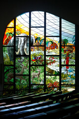 Saint Paul's catholic cathedral, Abidjan, Ivory Coast. Pews and stained glass.