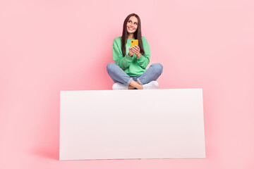 Photo of positive lovely cute lady wear trendy clothes sitting empty space look up interesting news...