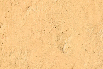 Abstract colorful yellow texture of cement wall and background.