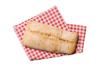 Freshly baked delicious french bread with napkin isolated on white background top view. Healthy...