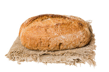 Freshly baked delicious french bread with napkin isolated on white background top view. Healthy white bread loaf