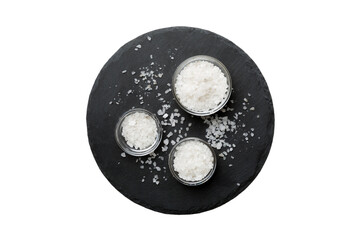 A wooden bowl of salt crystals isolated on white background. Salt in rustic bowls, top view with copy space