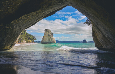 Curtains Gentle waves rolling into cathedral cove at a beach in New Zealand.