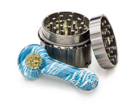 Glass pipe and cannabis grinder. Isolated on white background