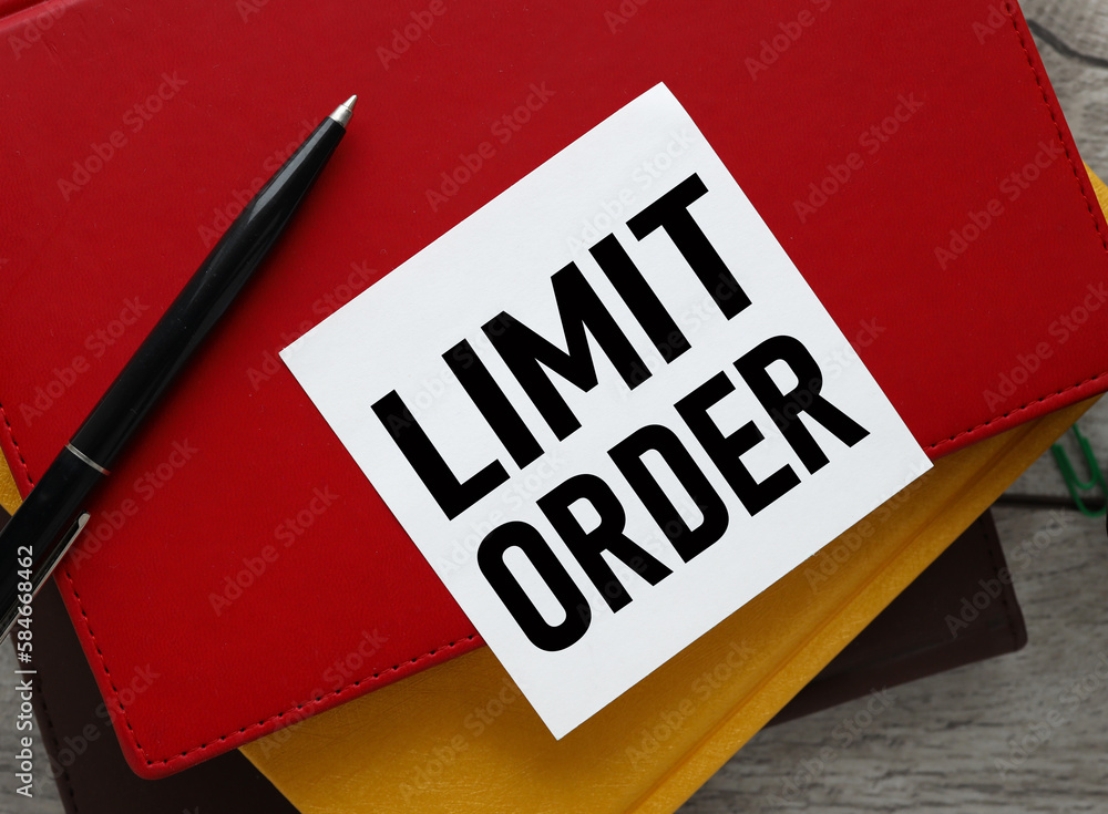 Poster limit order text on white paper. next to the red notebook