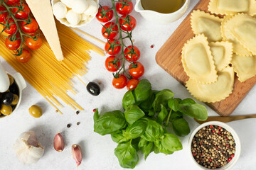 Pasta spaghetti, vegetables and spices on white