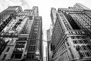 Manhattan street view with big buildings, New York, USA. Black and white - 584675450