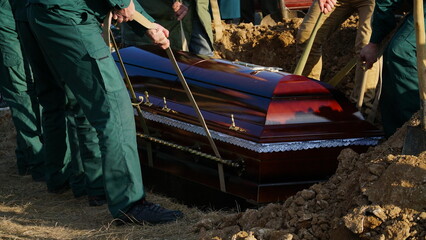 Funeral ceremony. People come to say goodbye. Burial in the grave.