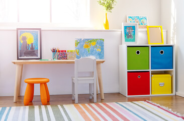 Comfortable room with colourful furniture in sunny day.