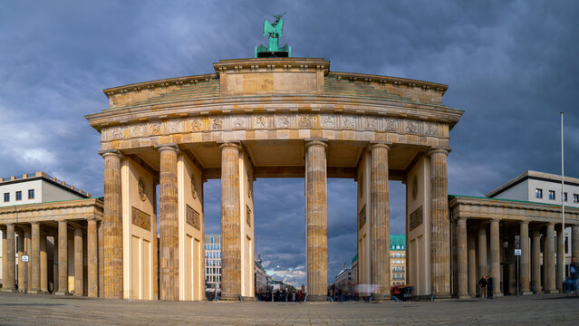 Brandenburg gate bridge at sunrise in Germany, long exposure photography with motion blur