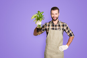 Portrait with copy space, empty place of attractive handsome florist with stubble having, showing,...