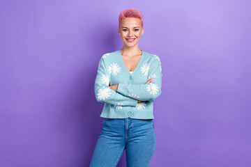 Photo of satisfied good mood cute woman with short hairstyle dressed blue cardigan hold arms crossed isolated on purple color background