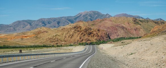 Road among dry mountain slopes, panoramic view