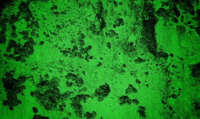 A textured green grunge background with dark patches and rough surface