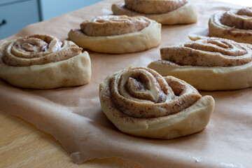 uncooked cinnamon buns decorated with granulated sugar