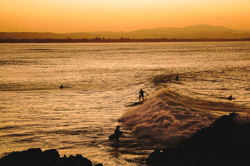 Golden hour sunset surf session in Byron Bay, Australia.