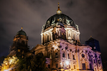 View Berliner Dom (Berlin Cathedral) at night. Dramatic sky, travel sightseeing