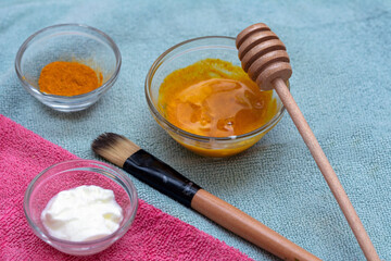 Homemade face mask with turmeric, yoghurt, coconut oil and honey for uneven skin tone, brightening dark spots and reducing fine wrinkles in diy beauty