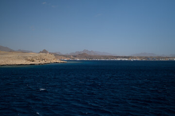 Fototapeta na wymiar Red Sea in the Gulf of Aqaba, surrounded by the mountains of the Sinai Peninsula, Dahab,