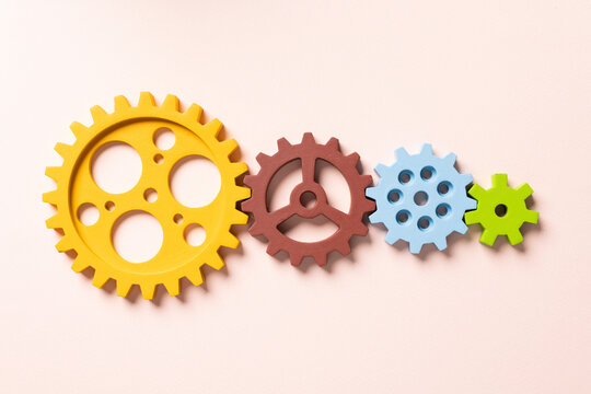 Top View Of Colorful Gears. Corporate Work And Modern Business Process Concept