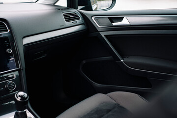 Modern car interior, control details, aluminum, leather steering wheel, Alcantara, car multimedia...