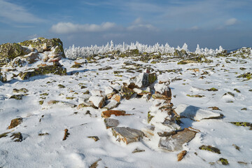 snow covered stone with sunny day.