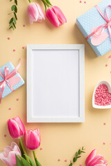 Mother's Day concept. Top view vertical photo of photo frame pink tulips blue gift boxes with...