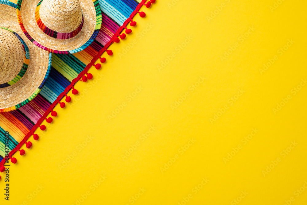 Wall mural mexican traditional costume concept. top view photo of sombrero hats and colorful striped serape on 