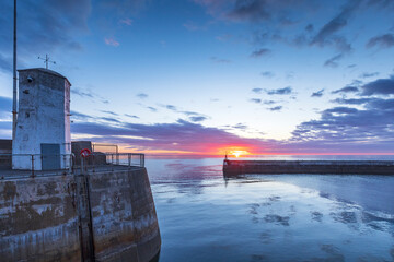 A colourful sunrise at Seahouses harbour on the Northumberland coast.