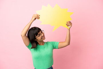 Youing woman holding an empty speech bubble