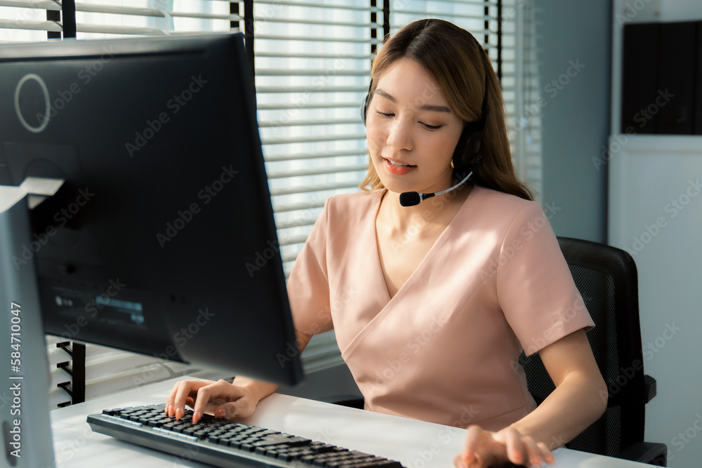 Aufkleber competent female operator working on computer and while talking with clients. concept relevant to bo