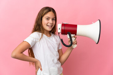 Child over isolated pink background holding a megaphone and smiling