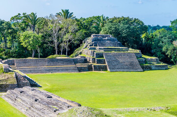 A view over the first plaza in the ancient Mayan city ruins of Altun Ha in Belize on a sunny day
