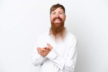 Redhead man with long beard isolated on white background applauding