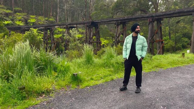 Indian Sikh Man Wearing Traditional Turban In Nature Landscape. Slow Motion