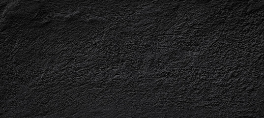 Empty concrete wall covering by plaster and painting in black colour.