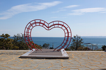 Sculpture of a heart on the shore