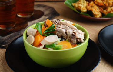 homemade chicken soup with vegetables, served in bowl
