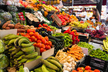 Fruits and vegetables stall in La Boqueria, the most famous market in Barcelona. One of the oldest markets in Europe that still exist. Established 1217. High quality photo