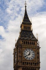 View of the top of the clock tower in London or Big Ben with a cloudy sky