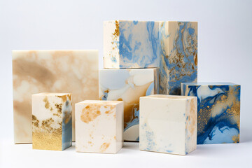 Blue, white and gold square marble blocks stacked on a grey background, copy space, product placement, generative AI